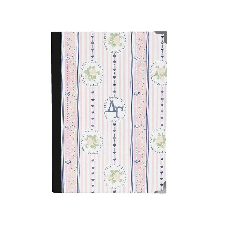 Notebook with decorative cover featuring stripes and circular patterns on a white background