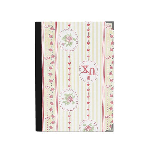 Decorative notebook with floral and heart patterns on a white background