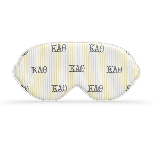 Sleep mask with ΚΑΘ branding on a white background