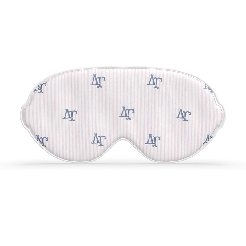 White sleep mask with blue ΔΓ letters on a white background