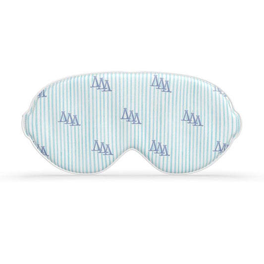 Sleep mask with blue ΔΔΔ letters on a white background