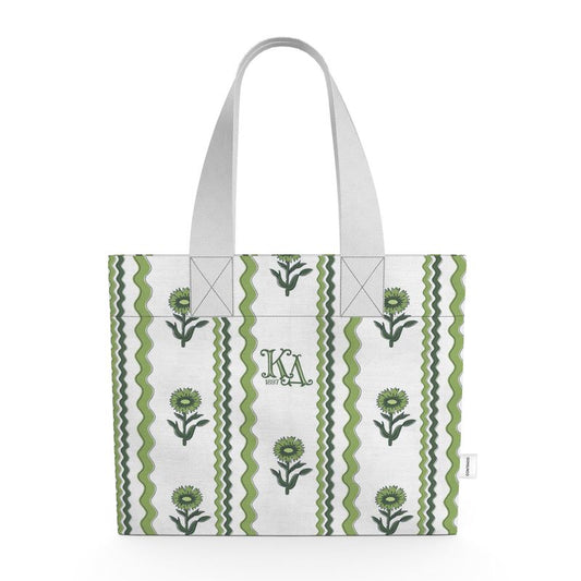 Tote bag with green floral patterns and white handle on a white background