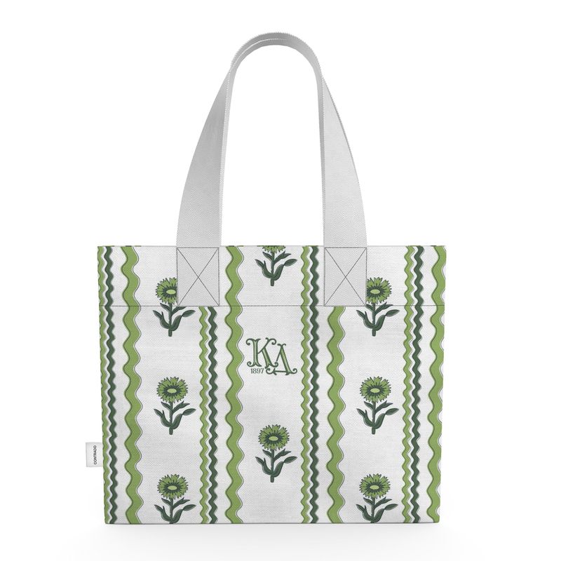Tote bag with green floral pattern and white handle on a white background