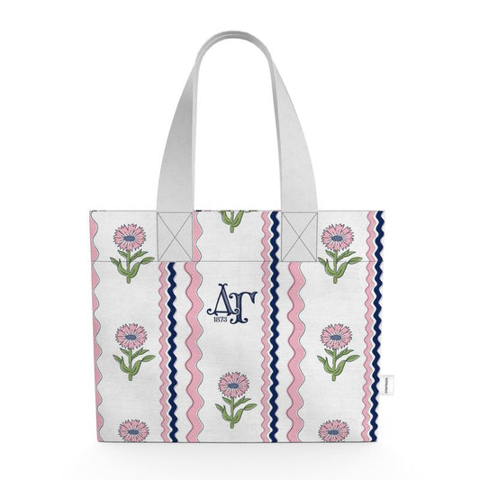 Tote bag with floral and striped pattern on a white background