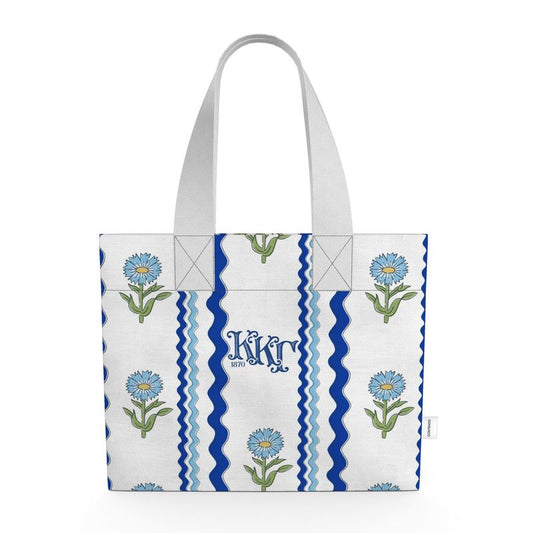 Tote bag with floral design and ΚΚΓ letters on a white background