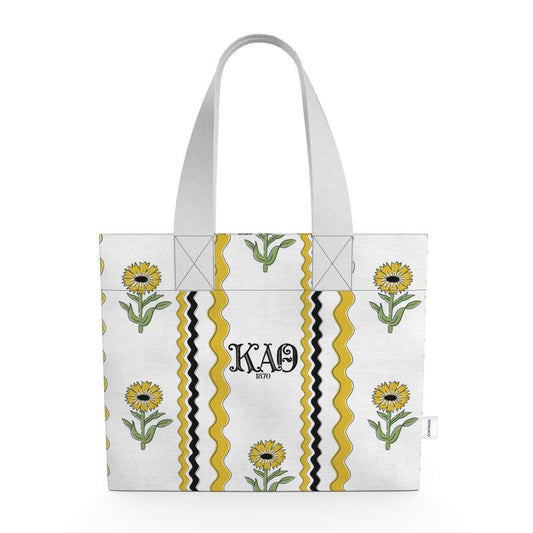 Tote bag with sunflower design and ΚΑΘ letters on a white background