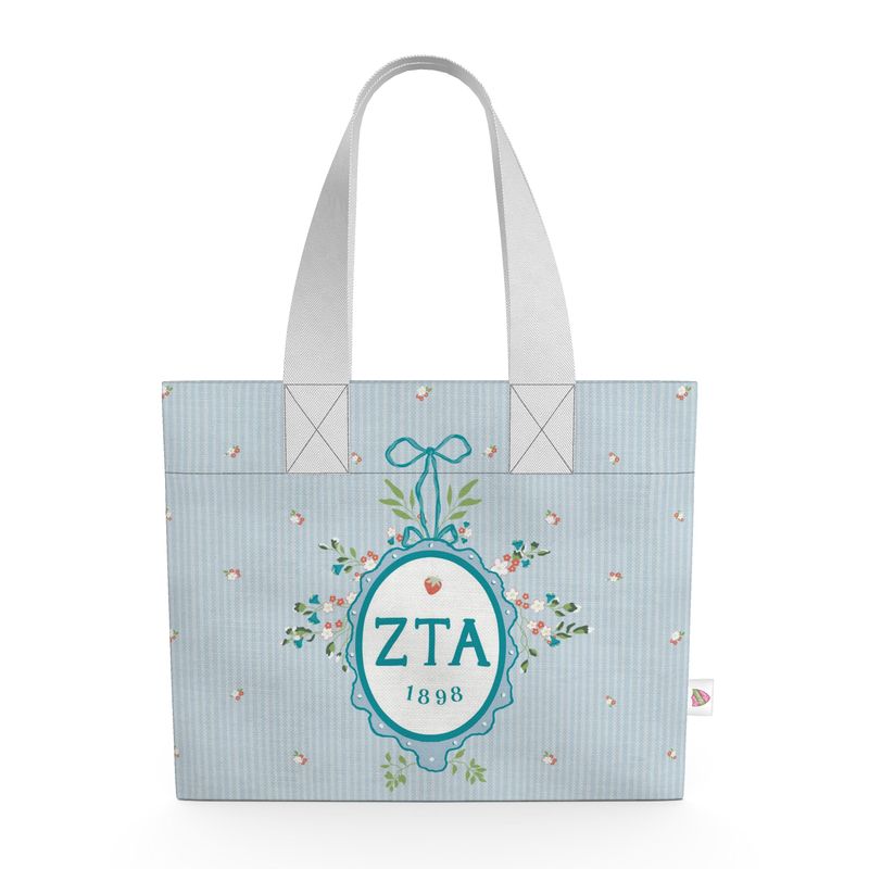 Tote bag with 'ZTA 1898' design on a light blue background