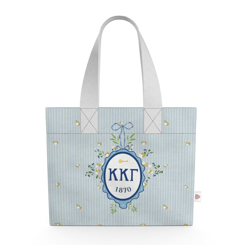 Tote bag with decorative design and text on a light blue background